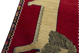 Backside of handmade 2000s Persian Gabbeh rug showing knot structure and weave density