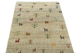 Surface texture of 2000s Persian Gabbeh rug with natural Wool and intricate pattern