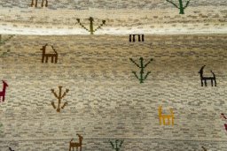 Full view of 2000s Persian Gabbeh rug from Iran / Persia, 141 × 105 cm in Beige tones