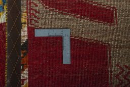 Corner detail of 2000s Persian Gabbeh rug showing border pattern and Wool pile