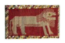 Full view of 2000s Persian Gabbeh rug from Iran / Persia, 131 × 82 cm in Red tones