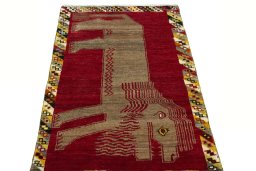 Surface texture of 2000s Persian Gabbeh rug with natural Wool and intricate pattern