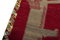Backside of handmade 2000s Persian Gabbeh rug showing knot structure and weave density
