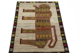 Surface texture of 2000s Persian Gabbeh rug with natural Wool and intricate pattern