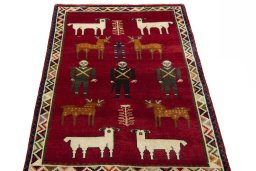 Surface texture of 2000s Persian Gabbeh rug with natural Wool and intricate pattern