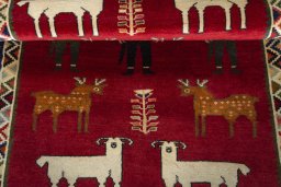 Full view of 2000s Persian Gabbeh rug from Iran / Persia, 153 × 107 cm in Red tones