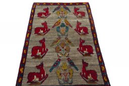 Surface texture of 2000s Persian Gabbeh rug with natural Wool and intricate pattern