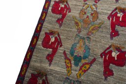 Backside of handmade 2000s Persian Gabbeh rug showing knot structure and weave density