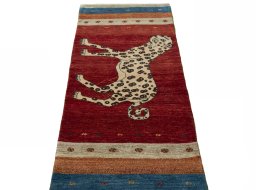 Surface texture of 2000s Persian Gabbeh rug with natural Wool and intricate pattern