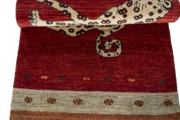 Full view of 2000s Persian Gabbeh rug from Iran / Persia, 192 × 81 cm in Red tones