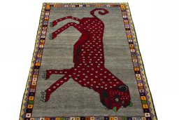 Surface texture of 2000s Persian Gabbeh rug with natural Wool and intricate pattern