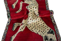 Corner detail of 2000s Persian Gabbeh rug showing border pattern and Wool pile