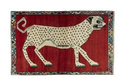 Full view of 2000s Persian Gabbeh rug from Iran / Persia, 167 × 106 cm in Red tones