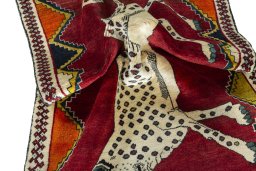 Corner detail of 2000s Persian Gabbeh rug showing border pattern and Wool pile