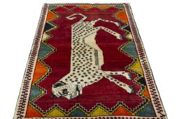 Surface texture of 2000s Persian Gabbeh rug with natural Wool and intricate pattern