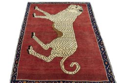 Surface texture of 2000s Persian Gabbeh rug with natural Wool and intricate pattern