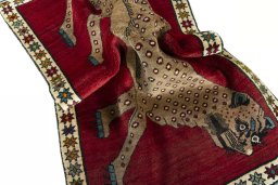 Corner detail of 2000s Persian Gabbeh rug showing border pattern and Wool pile