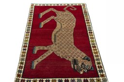 Surface texture of 2000s Persian Gabbeh rug with natural Wool and intricate pattern