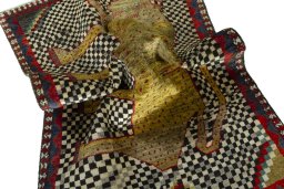 Corner detail of 2000s Persian Gabbeh rug showing border pattern and Wool pile