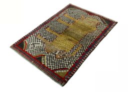 Corner detail of 2000s Persian Gabbeh rug showing border pattern and Wool pile