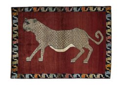 Full view of 2000s Persian Gabbeh rug from Iran / Persia, 193 × 140 cm in Red tones