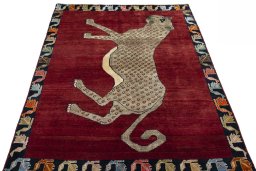 Surface texture of 2000s Persian Gabbeh rug with natural Wool and intricate pattern