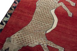 Backside of handmade 2000s Persian Gabbeh rug showing knot structure and weave density