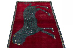 Surface texture of 2000s Persian Gabbeh rug with natural Wool and intricate pattern