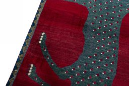 Backside of handmade 2000s Persian Gabbeh rug showing knot structure and weave density