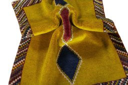 Corner detail of 2000s Persian Gabbeh rug showing border pattern and Wool pile