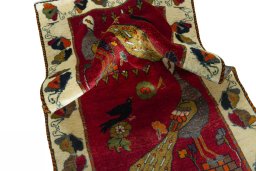 Corner detail of 2000s Persian Gabbeh rug showing border pattern and Wool pile