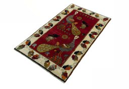 Corner detail of 2000s Persian Gabbeh rug showing border pattern and Wool pile