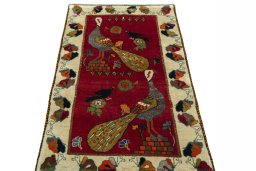 Surface texture of 2000s Persian Gabbeh rug with natural Wool and intricate pattern