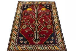 Surface texture of 2000s Persian Gabbeh rug with natural Wool and intricate pattern