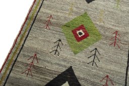 Backside of handmade 2000s Persian Gabbeh rug showing knot structure and weave density