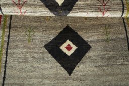 Full view of 2000s Persian Gabbeh rug from Iran / Persia, 196 × 106 cm in Beige tones