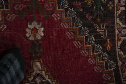 Surface texture of 2000s Persian Gabbeh rug with natural Wool and intricate pattern