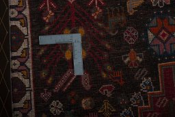 Backside of handmade 2000s Persian Gabbeh rug showing knot structure and weave density