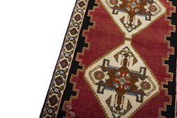 Backside of handmade 2000s Persian Gabbeh rug showing knot structure and weave density