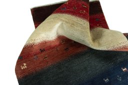 Corner detail of 2000s Persian Gabbeh rug showing border pattern and Wool pile