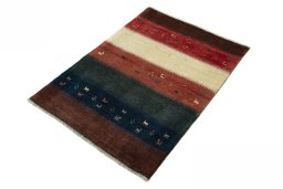 Corner detail of 2000s Persian Gabbeh rug showing border pattern and Wool pile