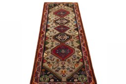 Surface texture of 2000s Persian Gabbeh rug with natural Wool and intricate pattern