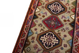Backside of handmade 2000s Persian Gabbeh rug showing knot structure and weave density