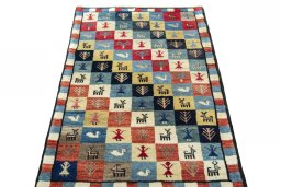 Surface texture of 2000s Persian Gabbeh rug with natural Wool and intricate pattern