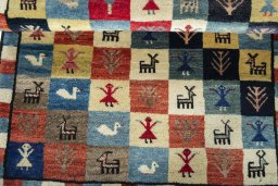 Full view of 2000s Persian Gabbeh rug from Iran / Persia, 137 × 90 cm in Multi Color tones