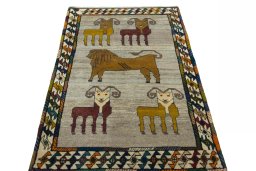 Surface texture of 2000s Persian Gabbeh rug with natural Wool and intricate pattern