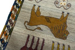 Backside of handmade 2000s Persian Gabbeh rug showing knot structure and weave density