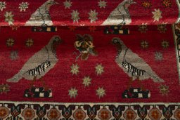 Full view of 2000s Persian Gabbeh rug from Iran / Persia, 165 × 115 cm in Red tones