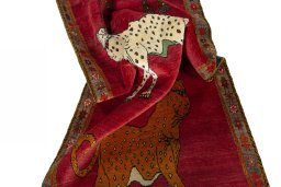 Corner detail of 2000s Persian Gabbeh rug showing border pattern and Wool pile