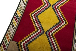 Backside of handmade 2000s Persian Gabbeh rug showing knot structure and weave density